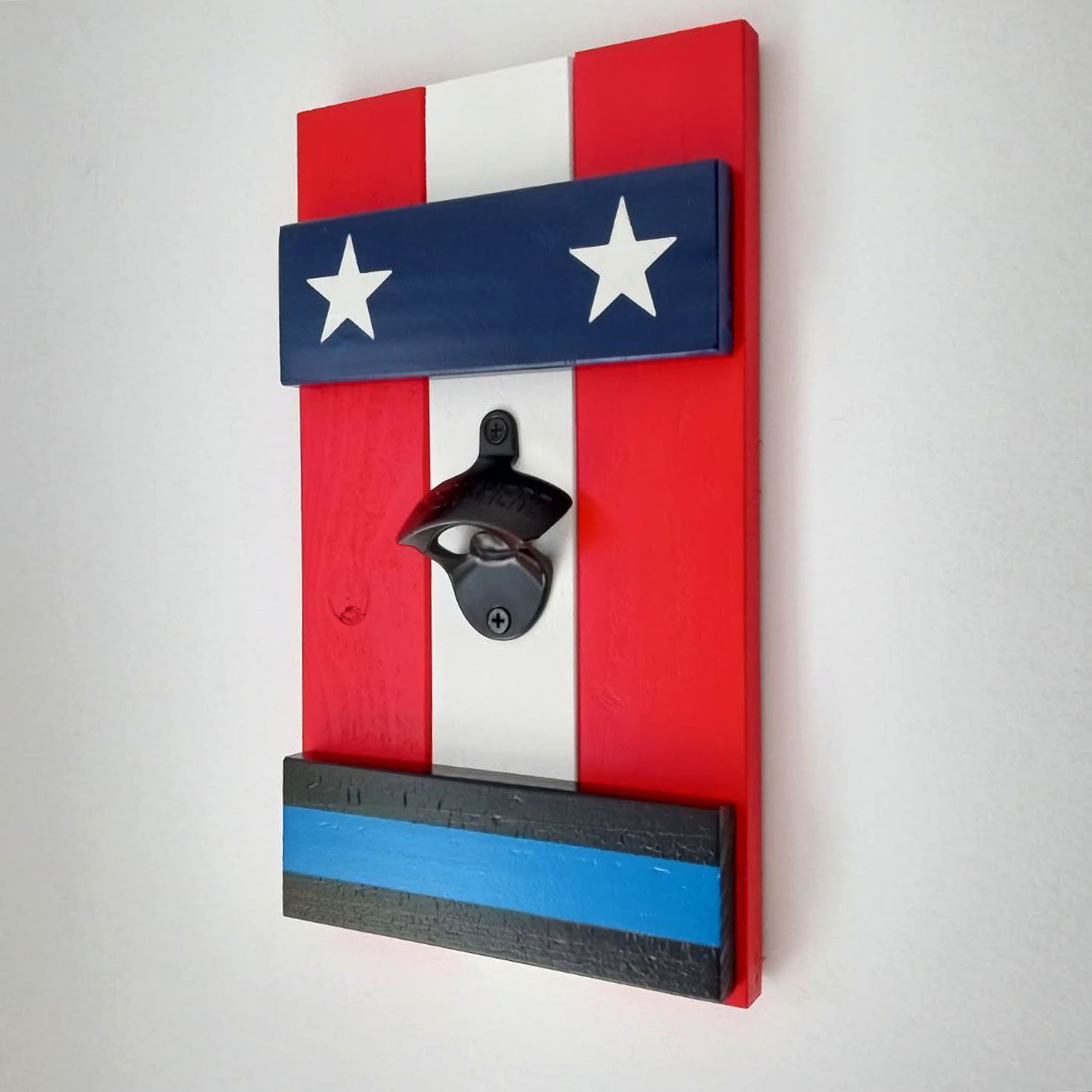 Wooden bottle opener with American flag design on a white background